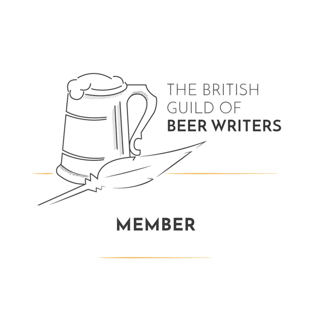 Picture of a pint of ale with a quill next to it, writing which says: "The British guild of beer writers, members"
